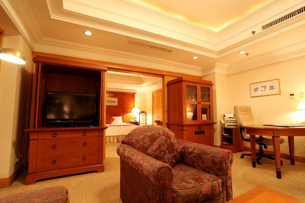 Ruishi Hotel Далиен Стая снимка